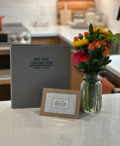 salmon design co for shiny penny construction branding and binder with flowers